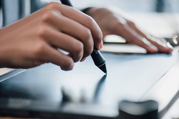 Businesswoman using graphic tablet 