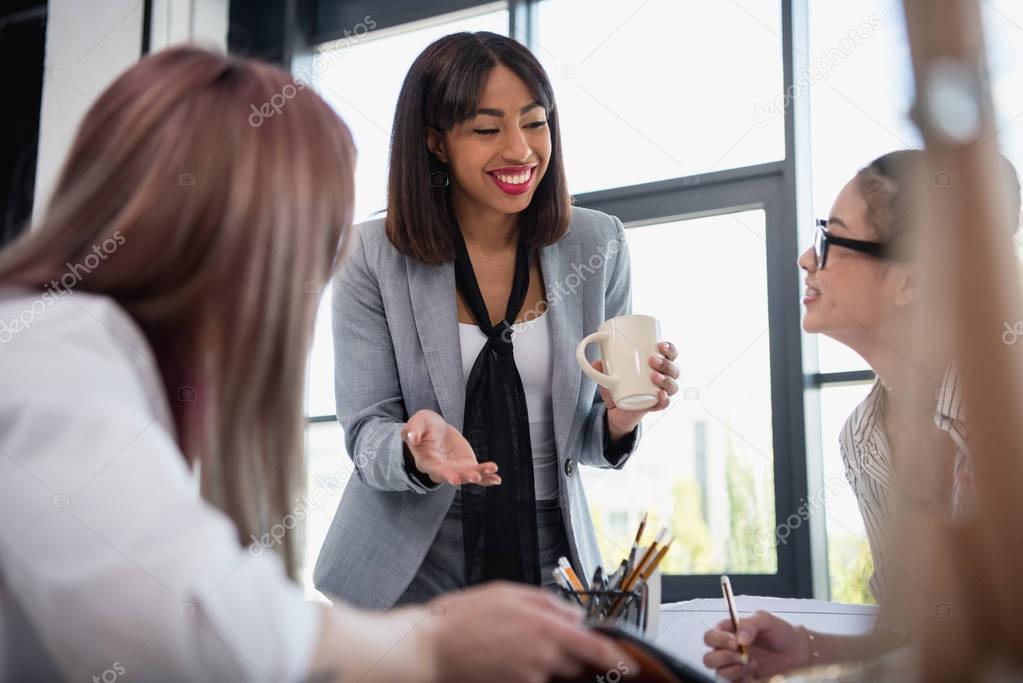 Businesswomen talking in office  