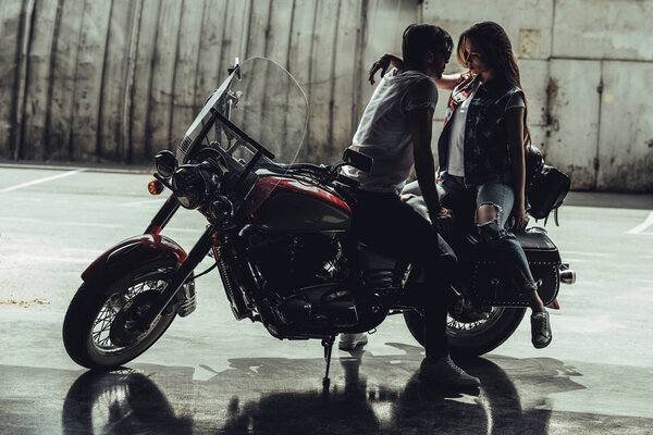 Young couple with motorcycle 