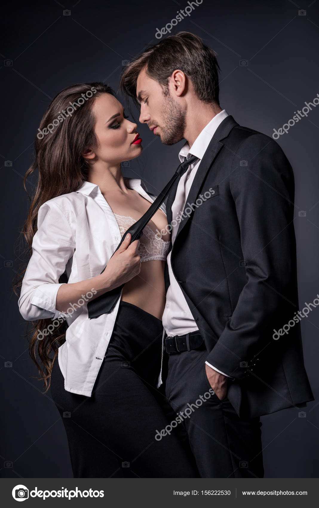 Girl seducing man in formal wear Stock Photo by ©ArturVerkhovetskiy 156222530 pic