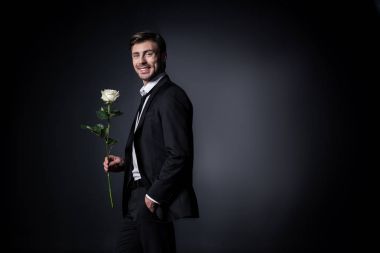 smiling man holding white rose clipart