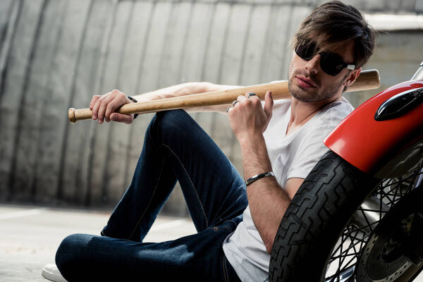 Stylish man with motorbike 