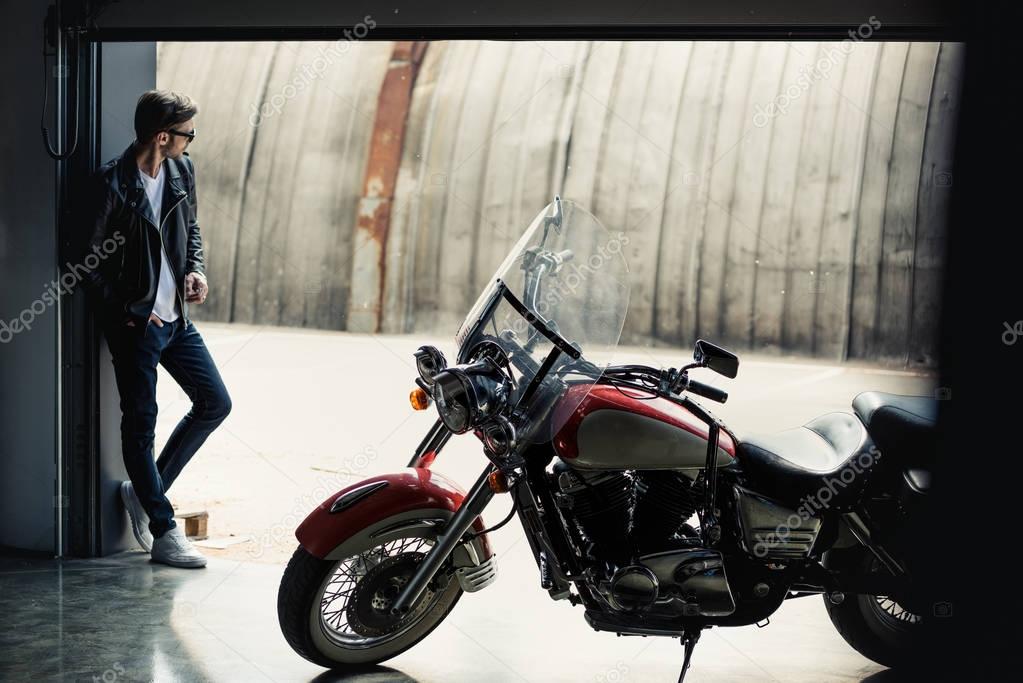 Stylish man with motorbike 