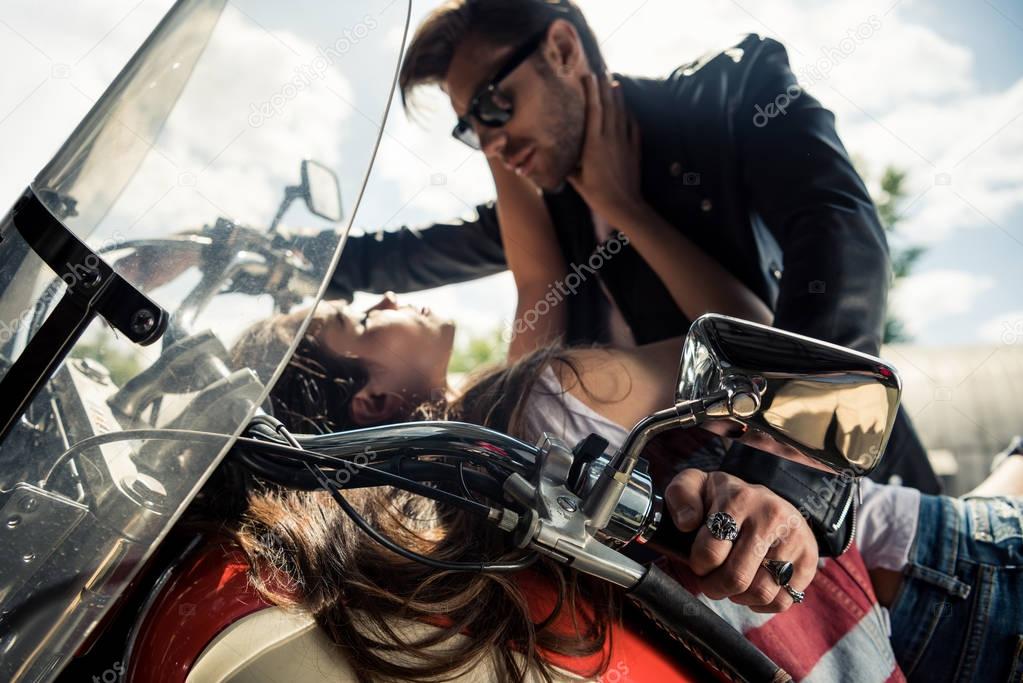 Young couple with motorcycle 