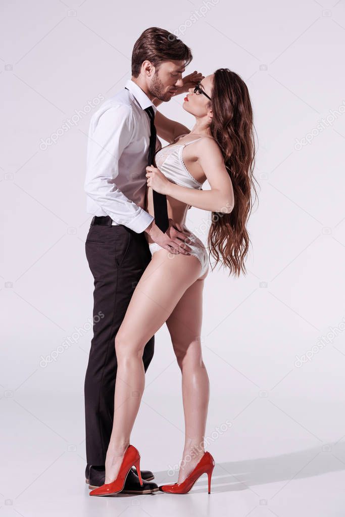 passionate woman in underwear seducing man