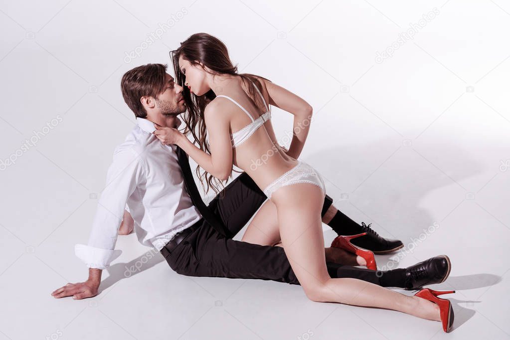 sexy woman in underwear seducing man