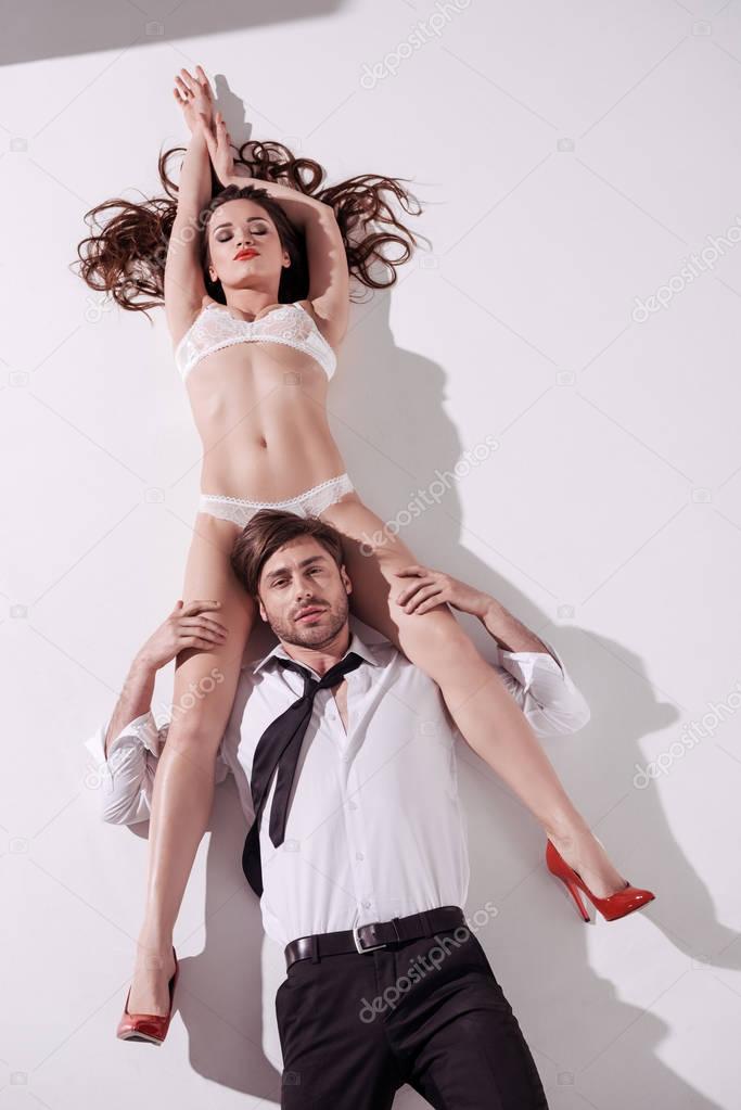 woman in lingerie lying with elegant man