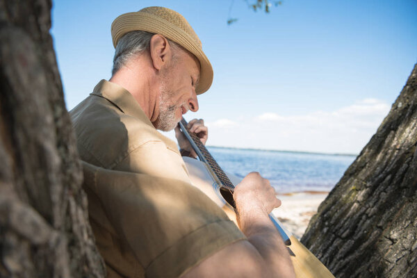 Senior man with guitar 