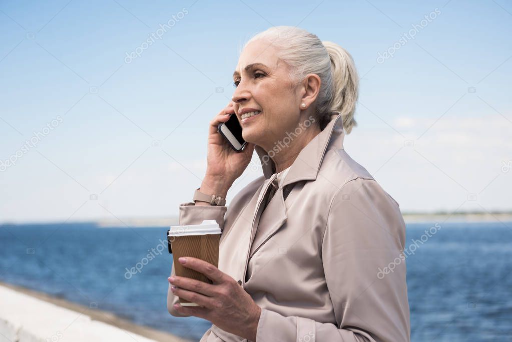 Senior woman talking on smartphone 