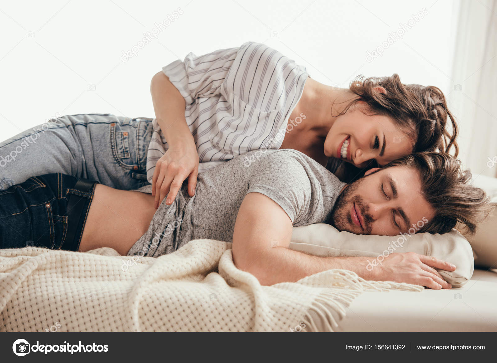 Young couple hugging at home Stock Photo by ©ArturVerkhovetskiy ...