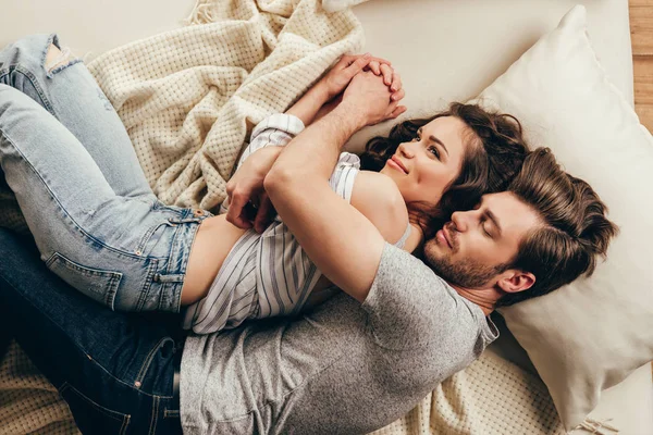 Young couple hugging at home — Stock Photo, Image