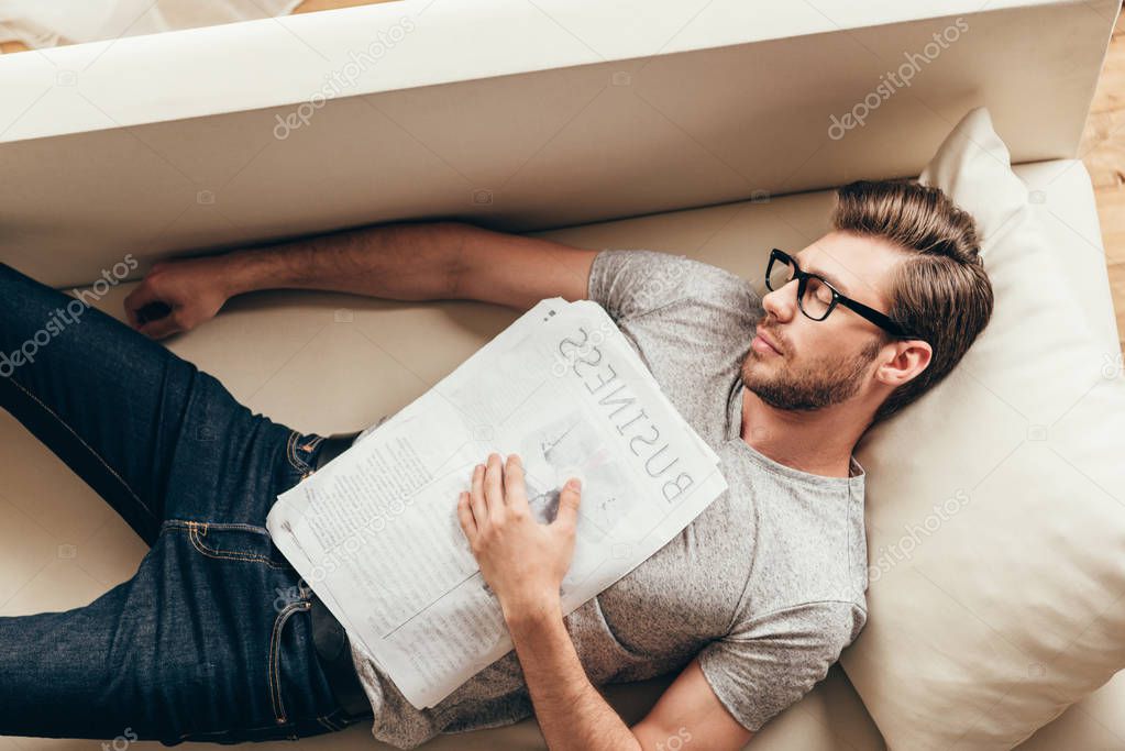 young caucasian man sleeping at home