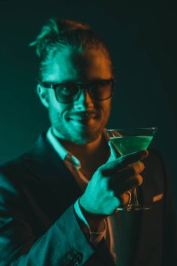 smiling man holding glass with cocktail clipart
