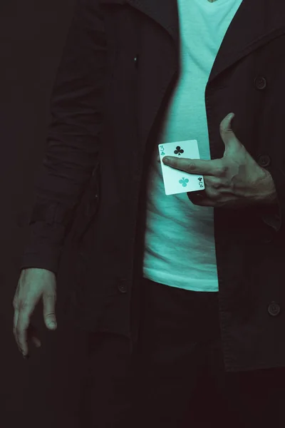 Casual man holding playing card — Stock Photo, Image