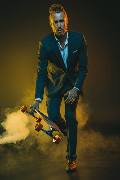 man in suit riding on skateboard