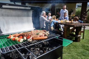 meat and vegetables cooking on grill clipart