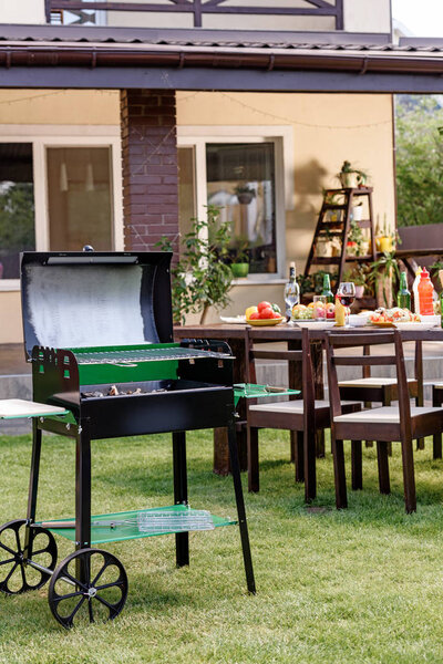 Grill on green lawn 
