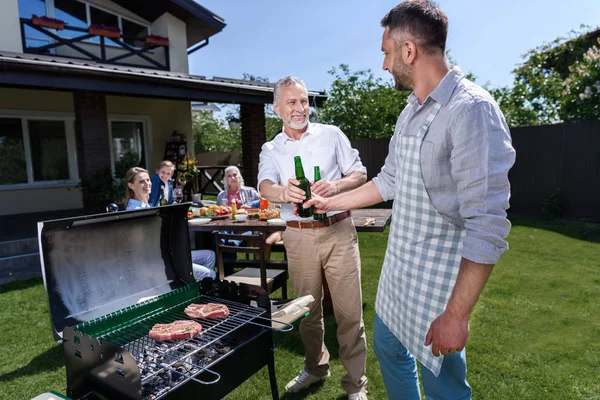 Happy family at barbecue — Stock Photo, Image