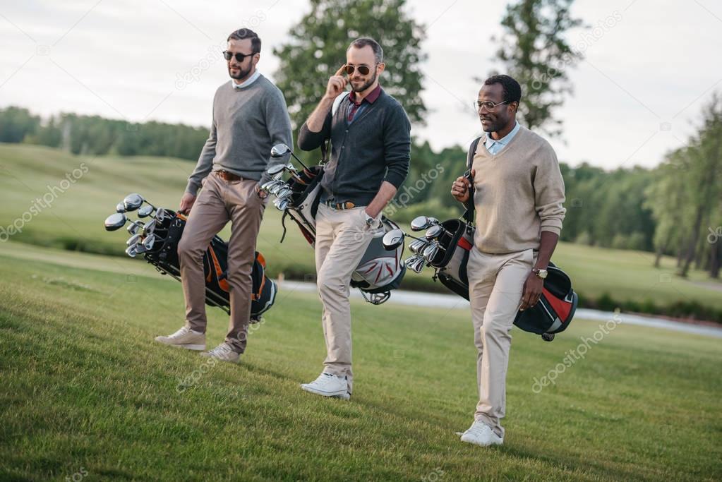 Golfers on golf course — Stock Photo © ArturVerkhovetskiy 157781232