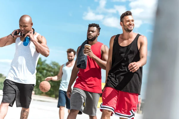 Multiethnic sportsmen on court — Stock Photo, Image