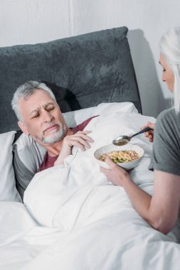 woman taking care of husband clipart