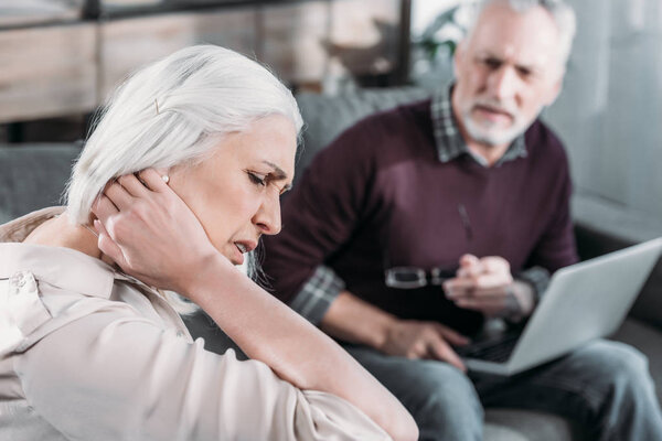 woman having neck ache