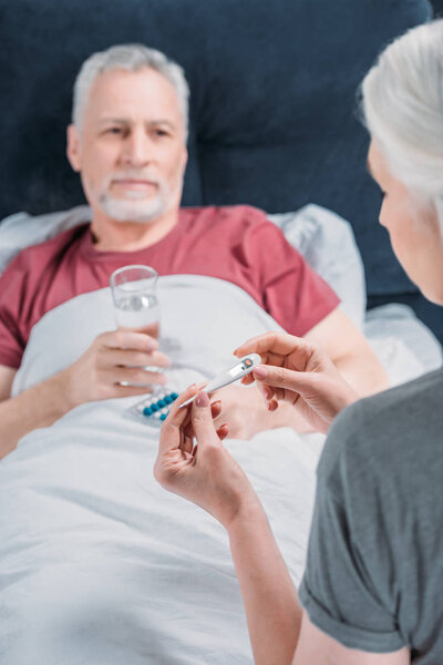 woman taking care of husband