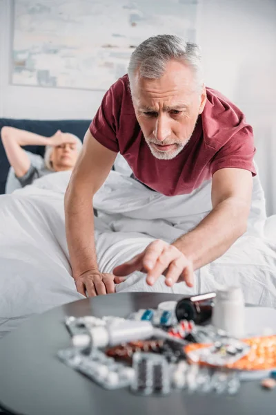 Sick couple in bed — Stock Photo, Image