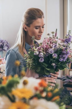 florist working in flower shop clipart