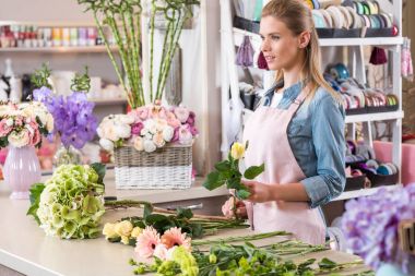 florist working in flower shop clipart