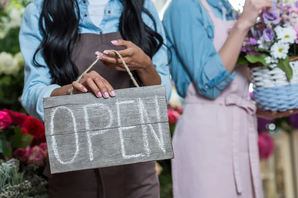 Florist holding open sign — Stock Photo, Image