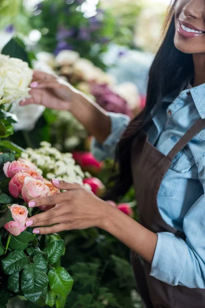 African american florist with flowers — Stok Foto