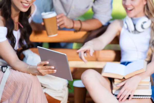 Students with digital tablet in park — Stock Photo, Image