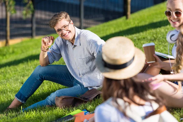 Happy students in park — Stock Photo, Image