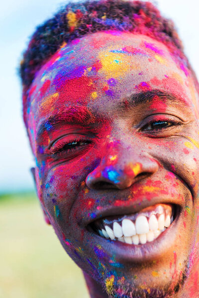african american man in colorful paint 