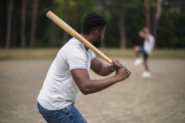 men playing baseball  clipart