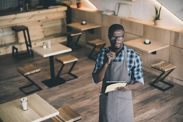 african american waiter taking order