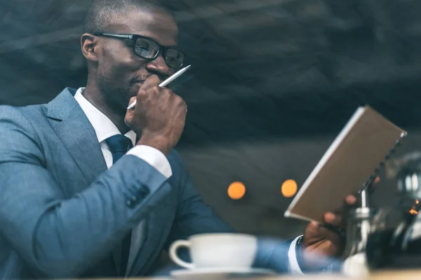 Businessman working in cafe — Stock Photo, Image