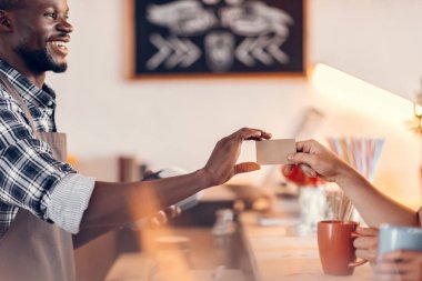 barista taking credit card clipart