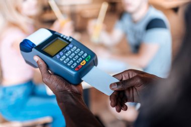 Waiter doing credit card payment clipart