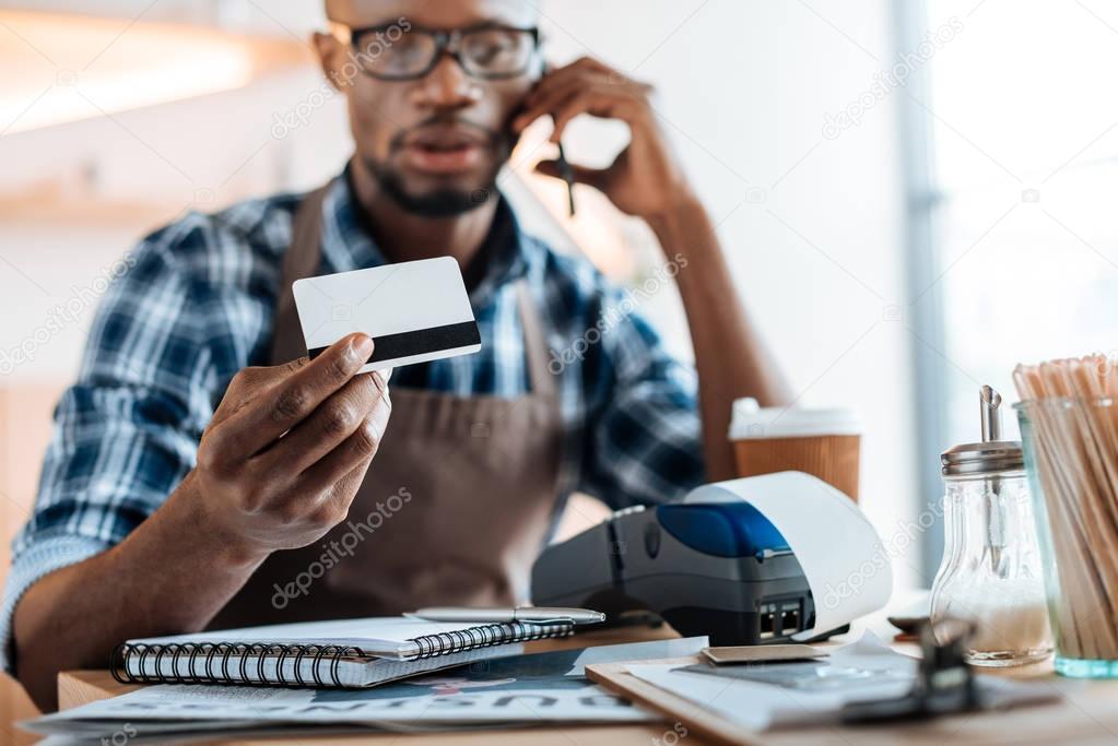 man working with payments and tablet