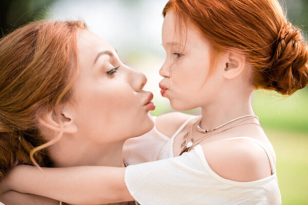 mother and daughter able to kiss