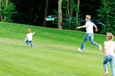 happy family playing with kite clipart