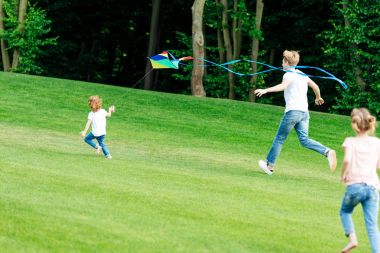 happy family playing with kite clipart