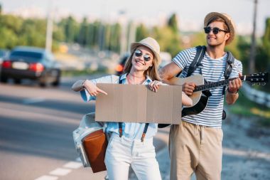 couple hitchhiking together clipart