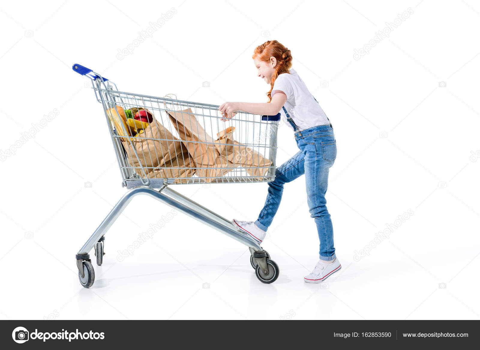 child in shopping trolley