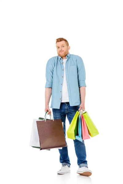Hombre joven con bolsas de compras — Foto de Stock