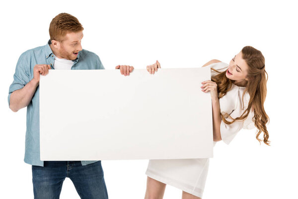 couple holding blank banner