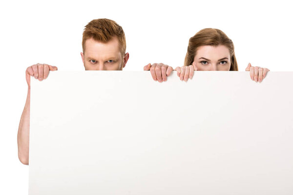 couple holding blank banner