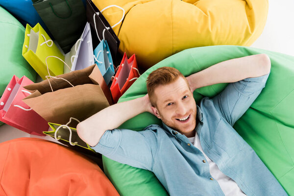 man resting in bean bag chair 